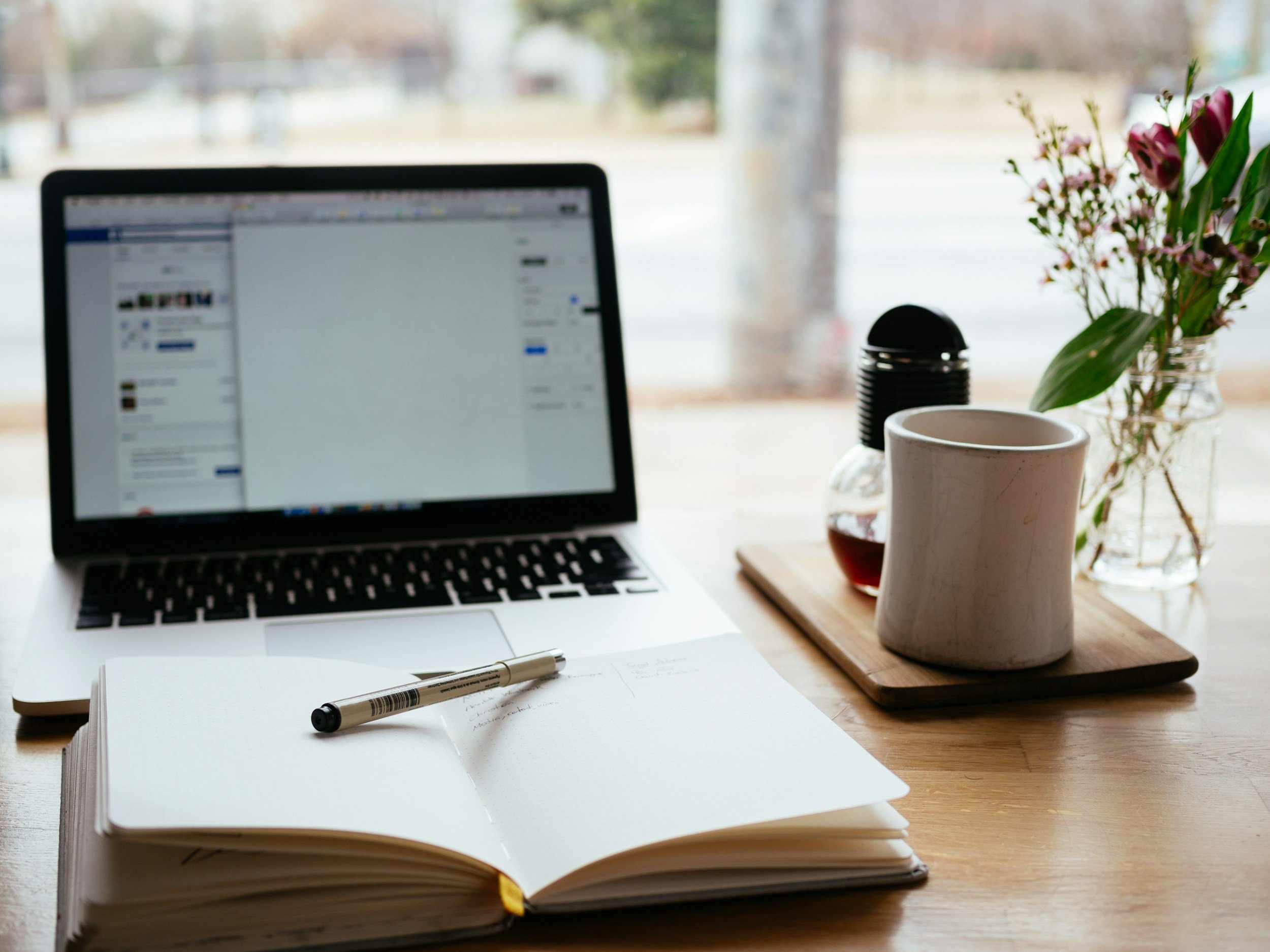 computer, notepad and tea